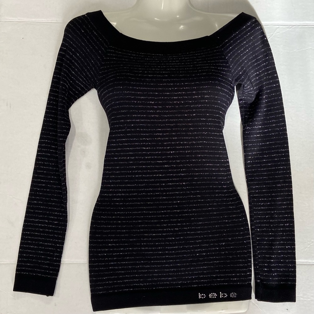 Bebe women black and silver stripes long sleeves fitted top. Size M/L. Used